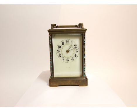 A 19th century brass carriage clock with champleve enamel detail, the dial with floral swag detail and eight day striking mov