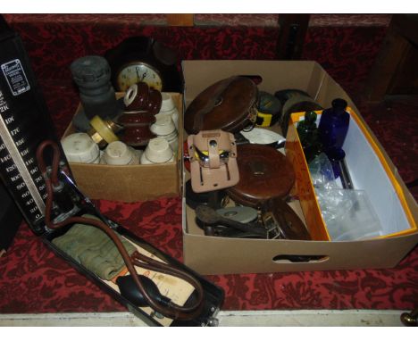 A collection of antique leather clad land tapes, together with later tape measures, a Smiths Enfield brown bakelite cased Acc