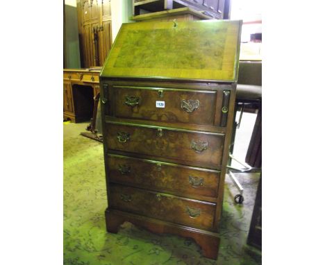 A small Georgian style figured and burr walnut veneered ladies writing bureau, the fall flap enclosing a simply fitted interi