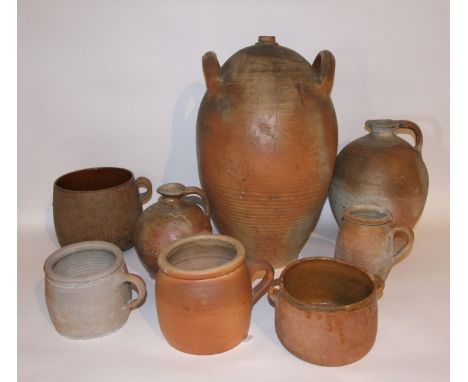 A collection of vintage French terracotta wares including a large two handled olive oil jar of ovoid form, height 54cm approx