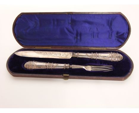 A cased Victorian silver serving set, Martin, Hall & Co., Sheffield, 1871, comprising: a knife and a fork, each handle with b