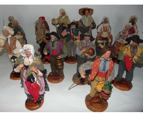 A vintage Brook's launderette and cleaners box containing a collection of approximately 16 French clay work figures/dolls, de