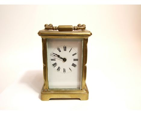 A brass carriage clock with eight day time piece 