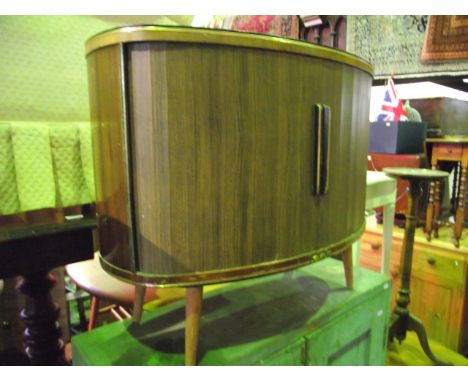 A pair of vintage GEC ex floorstanding speaker cabinets of oval form, enclosed by a pair of tambour sliding doors and raised 