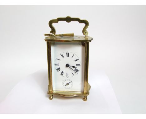 A brass carriage clock with eight day striking movement 