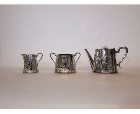 A 19th century A1 silver-plated teapot, two-handled sugar basin and milk jug, all with chased foliate detail, each with a vac