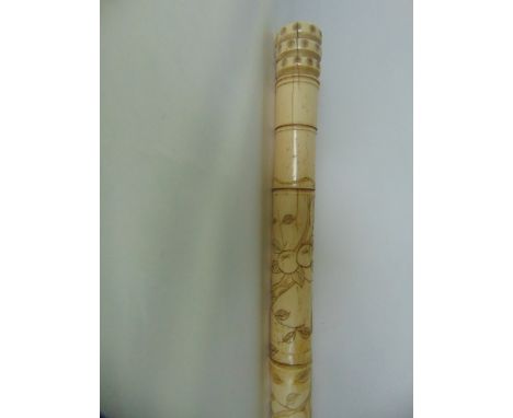 An antique Chinese worked bone walking stick of sectional composition, detailed with chased monkeys amongst fruiting branches