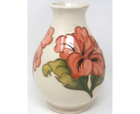 Moorcroft cream ground bulbous vase, in the Hibiscus pattern, H: 20 cm, small chips to rim of vase. P&amp;P Group 2 (£18+VAT 