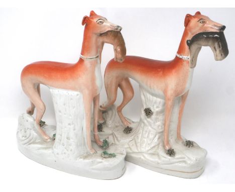 Pair of 19th century Staffordshire greyhound dogs, H: 28 cm, cracks to both bases and bodies, age marks and surface scratches