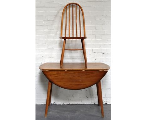 Ercol style oak kitchen table, oval top with two fall leaves, 107cm and four spindle back chairs.
