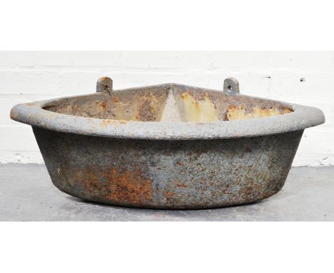 Iron corner feeding trough, width 92cm, two others and a wall mounted saddle rack.