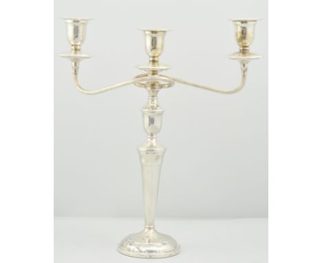 Silver plated three light candelabra, height 38cm, a four piece silver plated tea set and a glass fruit bowl with a plated ri