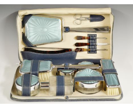 A lady's travelling vanity case, blue leather, satin lined, complete with all original fittings to include powder pots, hand 