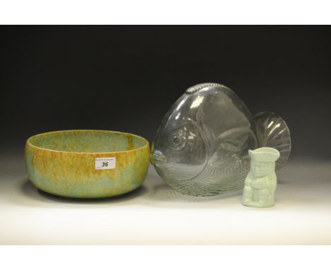 A Wadeheath pottery bowl; glass fish model; a green miniature Toby jug