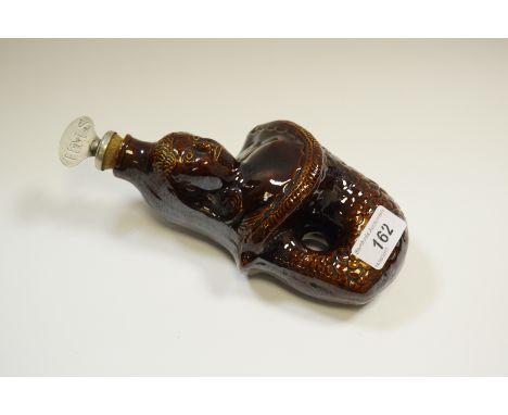 A 19th century treacle glazed mermaid flask, plated stopper, c.1890