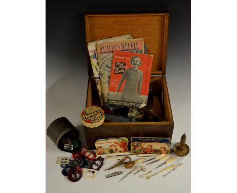 Sewing ephemera and equipment - a novelty bone tape measure; a tin of vintage buckles including Art Deco and mother of pearl;
