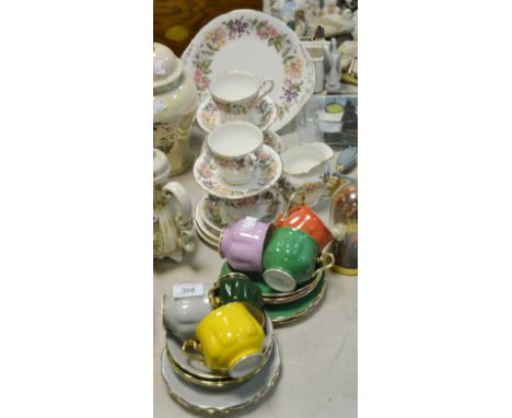 A Paragon Country Rose part tea service; a Staffordshire multi-coloured coffee set