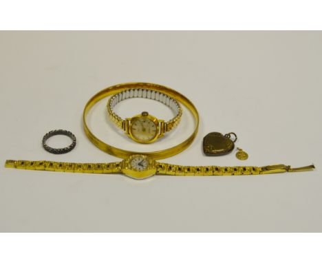 A 9ct gold St Christopher;  a 9ct gold plated bangle;  plated heartlocket  ladies watches;  etc 