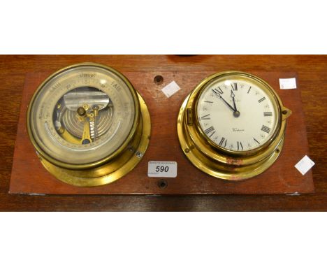 A Kienzle brass clock and barometer mounted on a mahogany plaque 