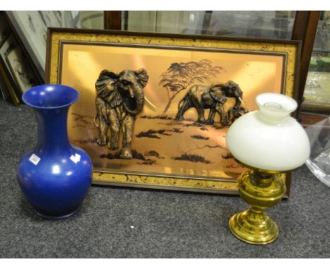 A Pilkington Royal Lancastrian mottled blue vase, 2216a;  a brass oil lamp; a copper embossed picture of elephants (3)