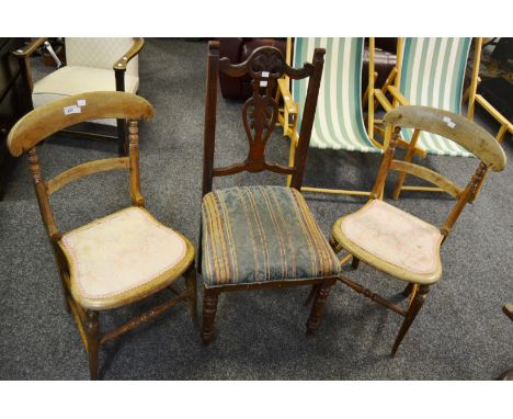 A Victorian mahogany hall chair, pierced carved splat, turned tapestry legs; a pair of farmhouse beech chairs (3)