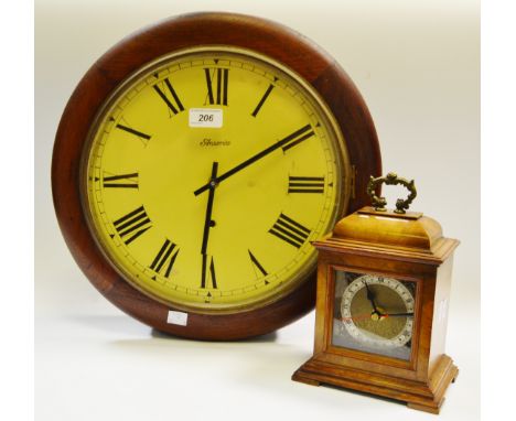 A 20th century mahogany circular wall clock by Ansonia; a burr walnut carriage clock (2)