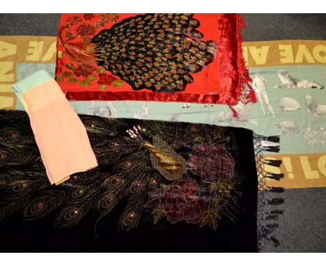 A Liberty style fringed silk velvet shawl, decorated with a peacock, embelished with beads, sequins and rhinestones on a mott
