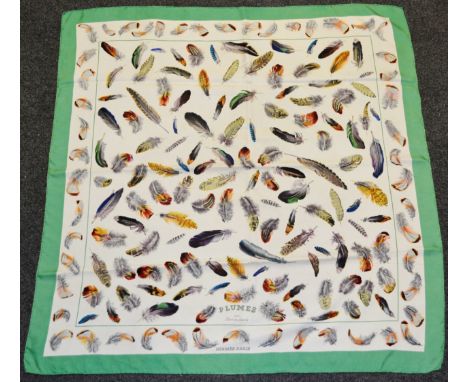 A Hermes of Paris silk scarf, Plumes par Henri de Linares, multi-coloured feather design, green border, hand rolled edge, 88c