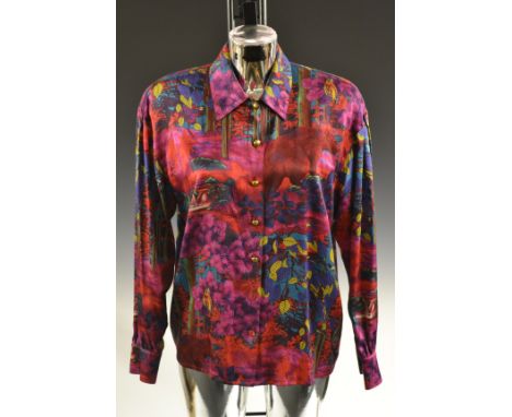 An Escada silk blouse, printed ducks on Paisley ground, two front pockets, size 38; an Escada silk blouse, brightly printed e
