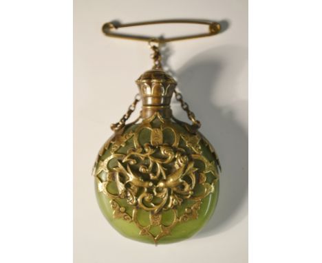 A chinoiserie inspired gilt brass and jade flattened ovoid scent bottle, the pierced brass overlay embossed with love birds p