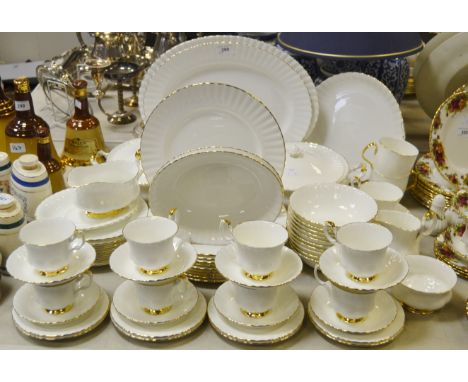 A Royal Albert Val D'or dinner and tea service for nine comprising dinner plates, dessert plates, side plates, teacups, sauce
