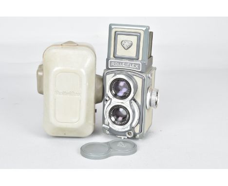 A Rolleiflex 4 x 4 Grey Baby Model K5 TLR Camera, serial no 2022943, shutter working, body G, a Schneider Kreuznach Xenar 60m