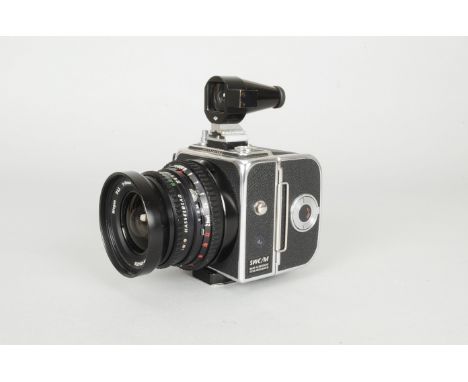 A Hasselblad SWC/M Camera, chrome, serial no RS 142451, shutter working, body VG, slight marks to base, with Carl Zeiss T* Bi