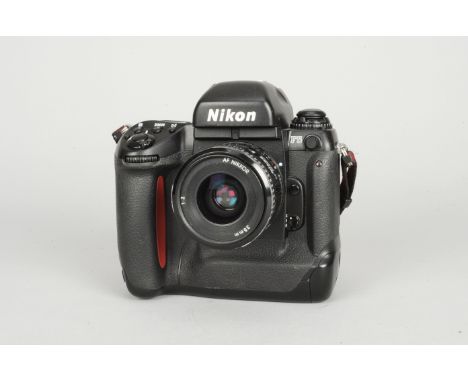 A Nikon F5 SLR Camera, serial no 3092073, shutter, camera appears to function correctly, body G-VG, some marks, with Nikkor A