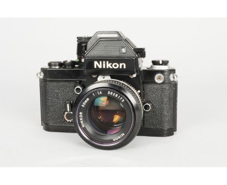 A Nikon F2 Photomic S SLR Camera, black, serial no 7204340, shutter working, timer working, body G-VG, some brassing to winde