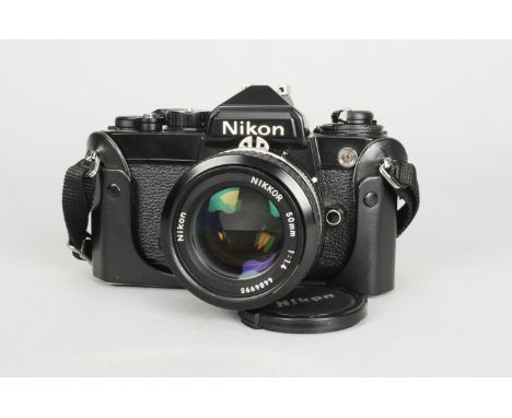 A Nikon FE SLR Camera, black, serial no 3526602, shutter working, timer working, body VG, with Nikkor 50mm f/1.4 lens, serial