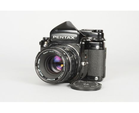 A Pentax 6x7 Camera, serial no 40410142, shutter working, with metered finder,meter responsive, body G, ding to top of viewfi