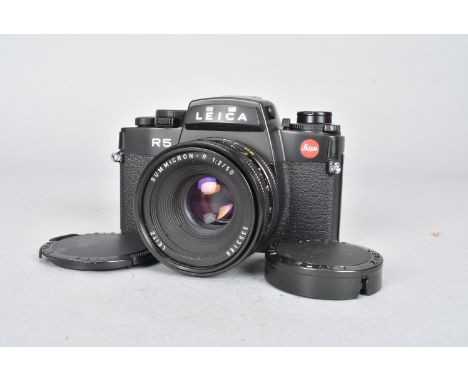 A Leica R5 SLR Camera, black, serial no 1754449, 1988, body G-VG, wear to eyepiece frame, shutter working, meter reacts to li