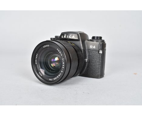 A Leica R4 SLR Camera, black, serial no 1662809, 1984/5, body G-VG, shutter working, meter reacts to light, with a Leitz Vari