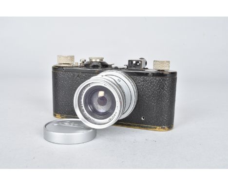 A Black Leica I Camera, serial no. 64474, 1931, standardised mount, shutter working, shutter button collar missing, body F, b