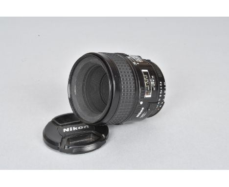 A Nikon AF Micro Nikkor 60mm f/2.8 D Lens, barrel G, elements F, light fungus, dust, with front cap 