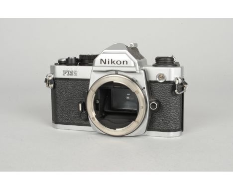 A Fine Nikon FM 2 SLR Camera Body,  chrome, serial no 7005494, shutter working, timer working, body VG,  