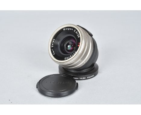 A Carl Zeiss Biogon T* 28mm f/2.8 Lens, for Contax G, serial no 7715762, barrel VG, elements G, with lens hood and maker's ca