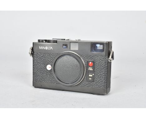 A Minolta CLE Rangefinder Body, serial no. 1027924, black, shutter working, metering responds to light, G, chip to rear of to