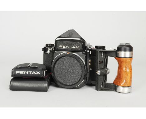 A Pentax 6x7 Camera Body, serial no 4136516, shutter working, body G, small ding to top of viewfinder, slight brassing, wear 