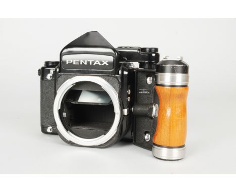 A Pentax 67 Camera Body, serial no 4197351, apparent electrical issue, battery check light not illuminating, shutter not firi