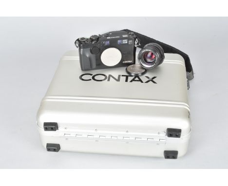 A Contax G2 Rangefinder Camera, serial no 050354, shutter working, metering responds to light, body G, a Carl Zeiss Planar T*