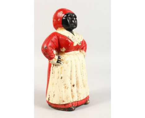 A VICTORIAN PAINTED CAST IRON MONEY BOX OF A LADY, in a red dress and scarf with white apron. 10.5ins high.
