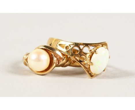 A 9CT GOLD PEARL RING and AN OPAL RING (2).