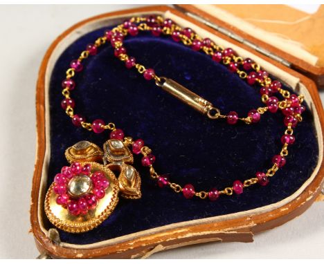 A GOOD VICTORIAN RUBY AND DIAMOND PENDANT AND CHAIN.
